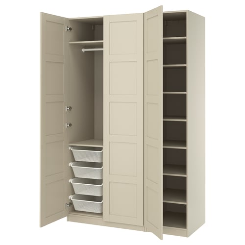 A beige PAX wardrobe with open doors, revealing storage baskets and shelves inside.