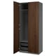 An open wooden wardrobe with grey interior and mesh baskets. Its a PAX model with a sleek, modern design in dark wood colour.