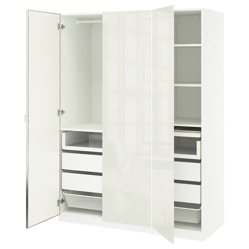 A white IKEA PAX wardrobe with mirrored doors, multiple shelves, and drawers for storage.