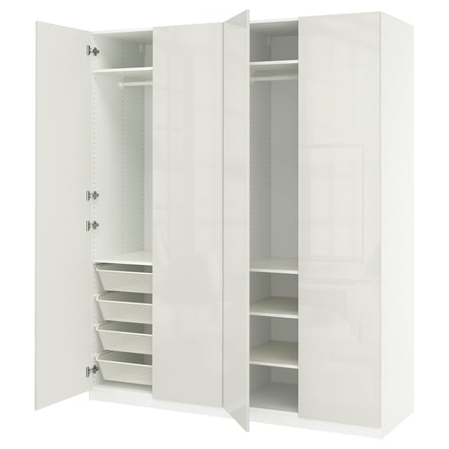 A white PAX wardrobe with open doors revealing shelves and drawers.