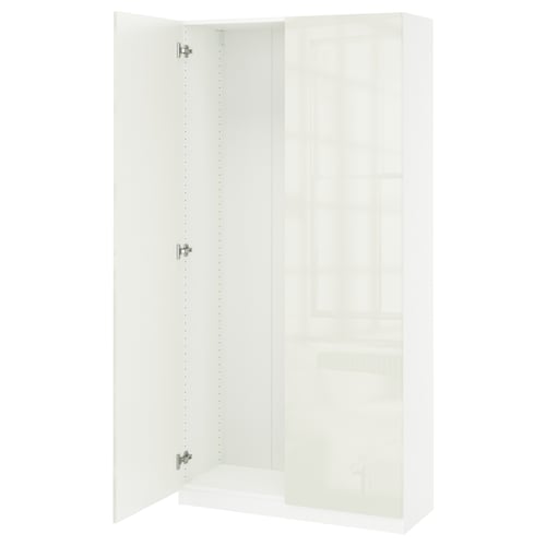 A white PAX wardrobe with one open door, featuring soft-close hinges.