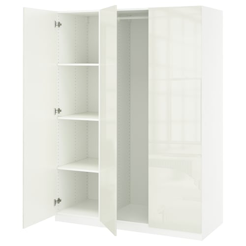 White PAX wardrobe with open doors showcasing shelves, in modern minimalist design.