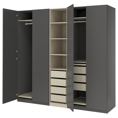 A grey PAX wardrobe with three open sections, featuring shelves, drawers, and a hanging rod.
