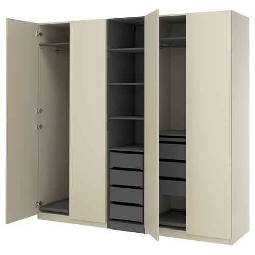 A beige PAX wardrobe with open doors, revealing shelves and drawers inside.