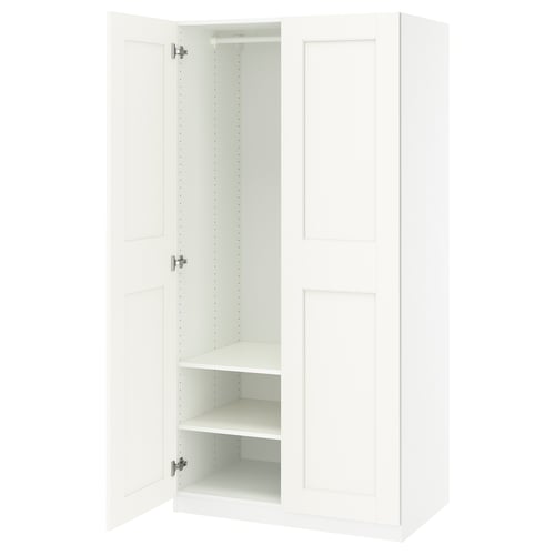 White PAX wardrobe: slim, tall, minimalist design. Soft-close doors, internal shelves.