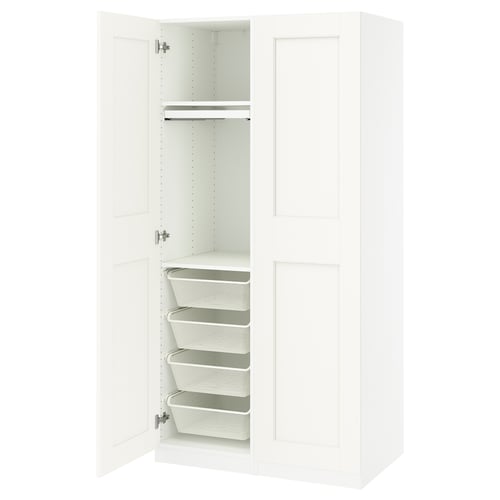 This image shows a white IKEA PAX wardrobe with an open door revealing integrated mesh baskets and a clothes rail.