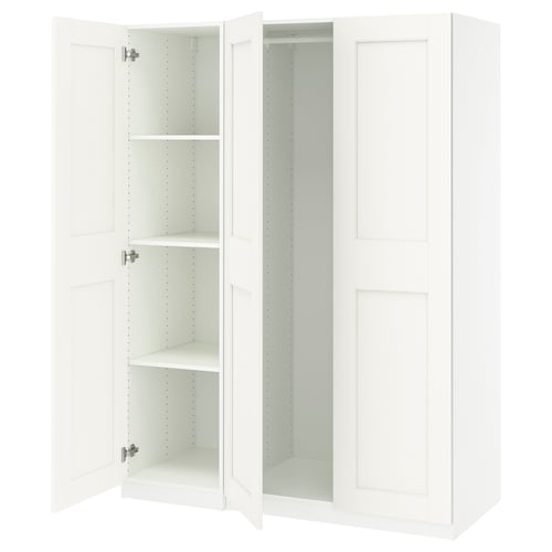 A white IKEA PAX wardrobe with open doors. It has adjustable feet and hinges with soft closing mechanisms.