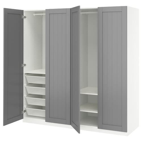 A grey PAX wardrobe with open doors revealing shelves and mesh drawers.