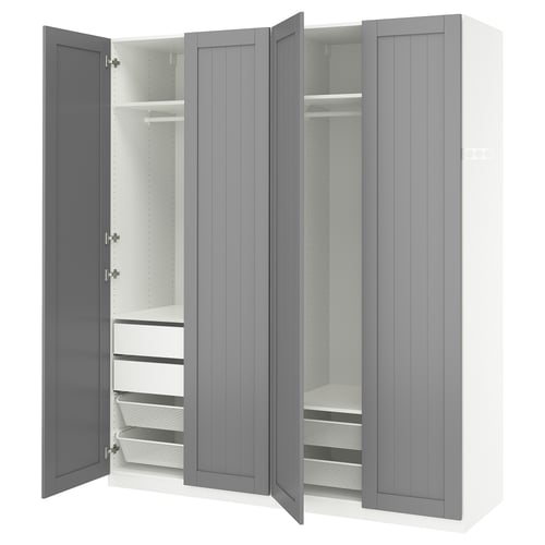 Grey PAX wardrobe with open doors, white interior, shelves, drawers, mesh baskets, and soft-close hinges.