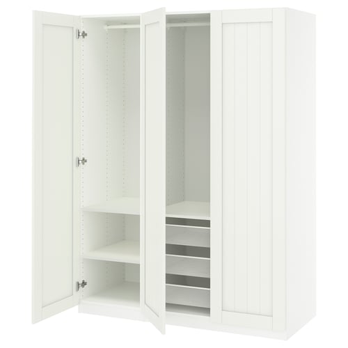 White PAX wardrobe with open doors revealing shelves and a mesh basket.