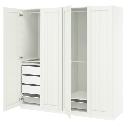 White PAX wardrobe: fully open, showing drawers, shelves, mesh basket, steel rail, and soft-close hinges.