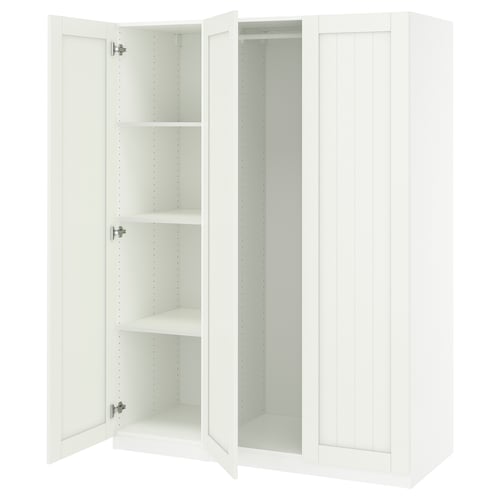 White PAX wardrobe, tall and narrow, open with empty shelves.