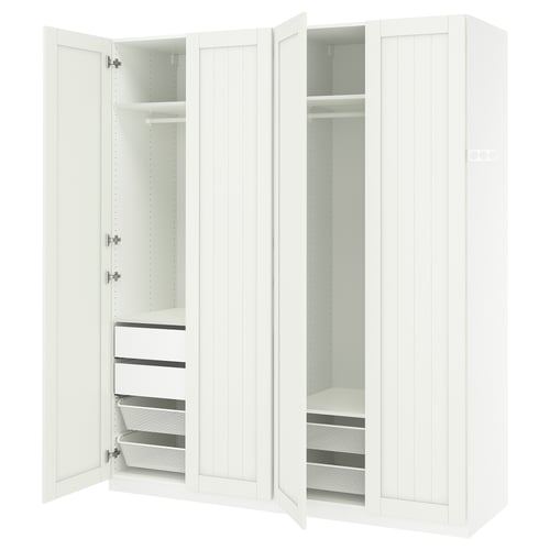 A white PAX wardrobe with open doors, revealing shelves, drawers, and mesh baskets inside.