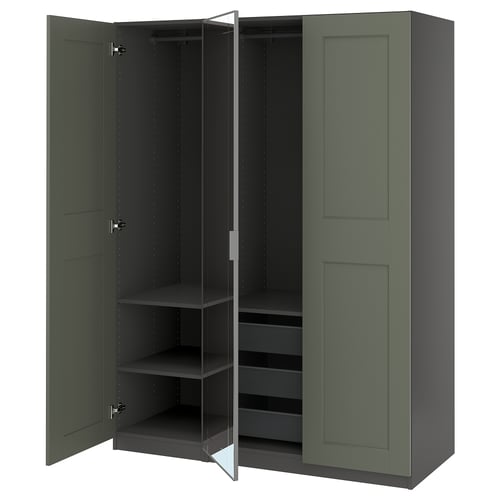 An open green PAX wardrobe with shelves and a mesh basket.
