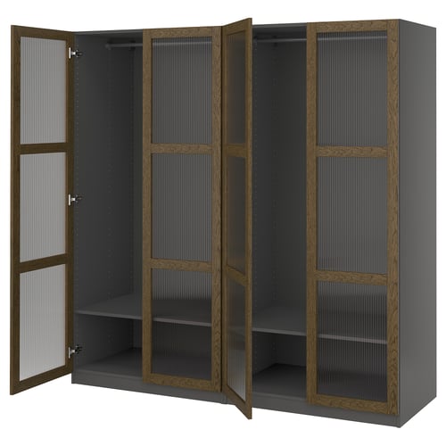 A grey ikea PAX wardrobe with wooden trim and frosted glass doors. It has four open sections revealing empty shelves and a hanging rod.