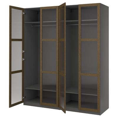 An open ikea PAX wardrobe in dark grey with glass doors. It a modern design with adjustable shelving.