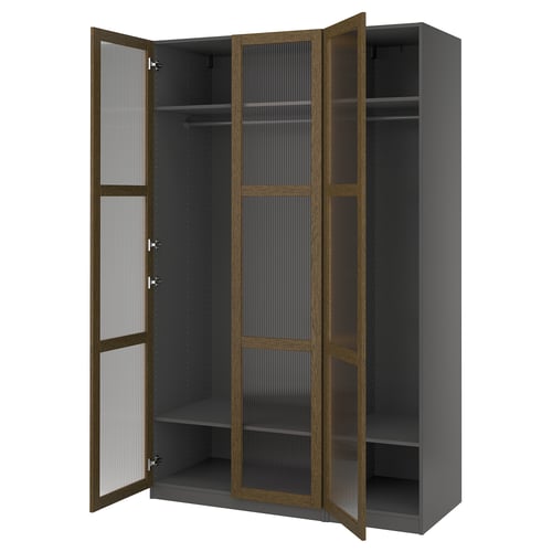 Open grey PAX wardrobe with brown trim and glass doors showing empty shelves and hanging rod.