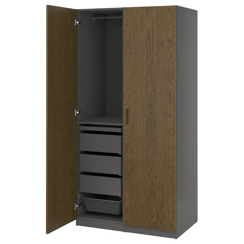 Wooden and grey PAX wardrobe, open doors revealing shelves and drawers.