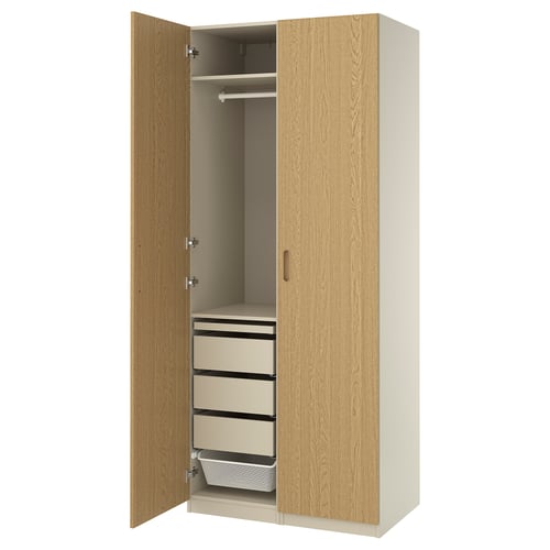 PAX wardrobe in oak. Tall, slim design with hanging space and three drawers, plus a mesh basket.