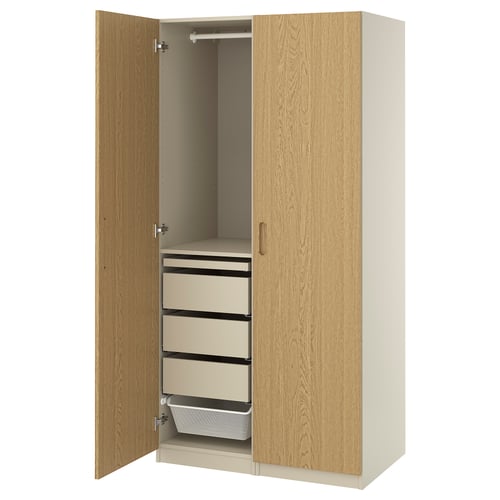 A PAX wardrobe in oak veneer with adjustable drawers and hanging space, perfect for any room.