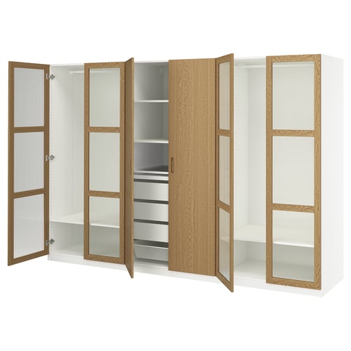 White PAX wardrobe with wood accents and glass doors. Shown fully open, reveals shelves and drawers.