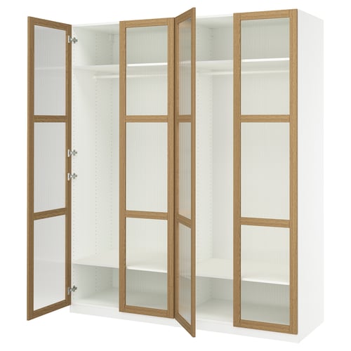 White PAX wardrobe with three oak doors, two open, featuring clear glass panels and soft-close hinges.