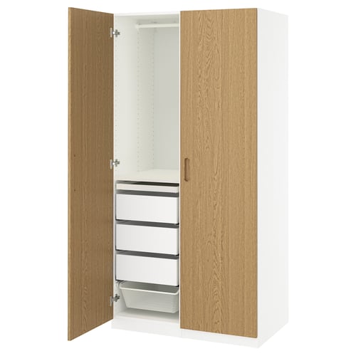 A white PAX wardrobe with oak doors, featuring shelves and drawers inside.