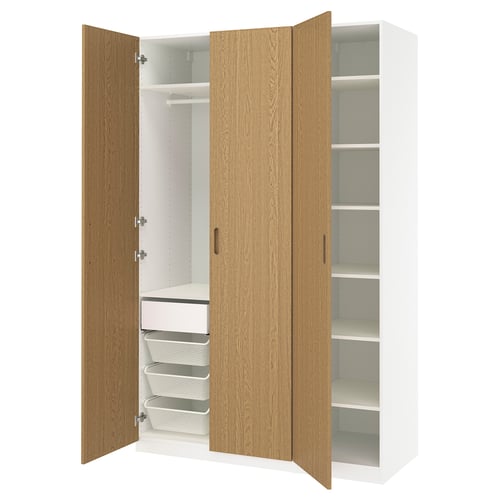 An open wooden wardrobe named PAX with shelves and drawers, ideal for folded clothes.