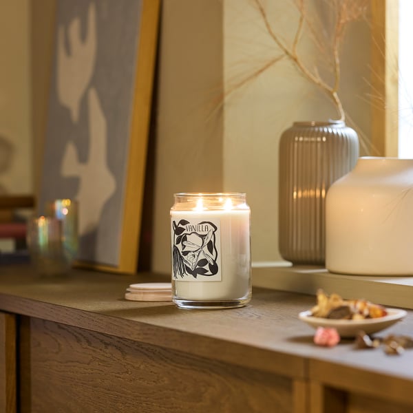 Cosy living room with scented candle & vases.