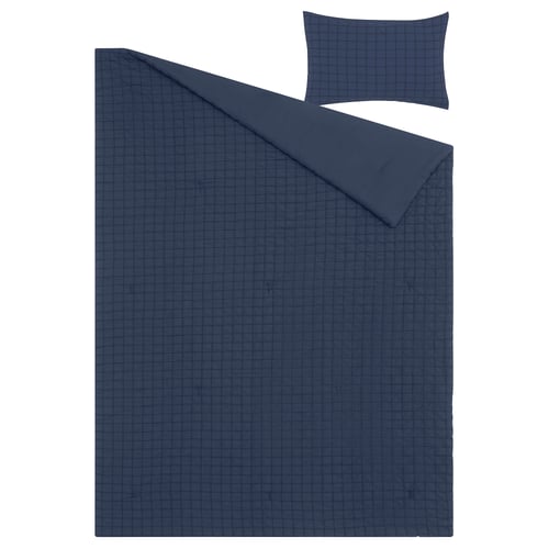 Dark blue bedding set featuring chequered seersucker texture, including a fluffy comforter and a pillow sham.