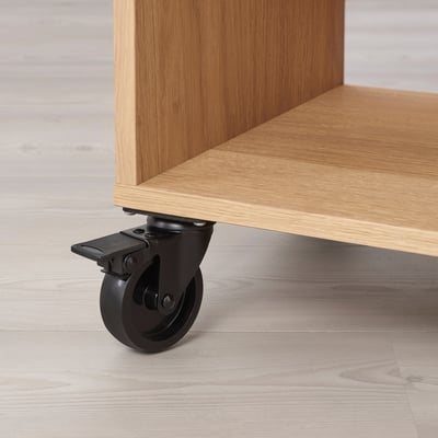 Close-up of wooden shelving units caster wheels, showcasing quality craftsmanship.