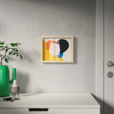 Modern frame with colourful abstract art, plant, and decor. Can hang or stand for varied depth.