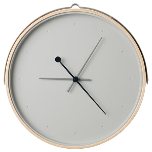 Round white wall clock with black hands and wooden frame.