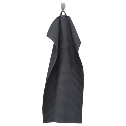 Dark grey SALVIKEN towel hanging, textured side out.