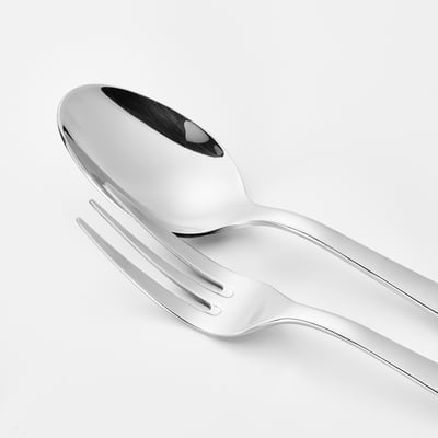 Polished stainless steel fork and spoon; sleek, reflective surfaces; clean, modern design.