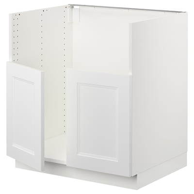 White SEKTION kitchen cabinet. Modern, rectangular design with recessed panel fronts. Metal hinges, melamine and particleboard construction.