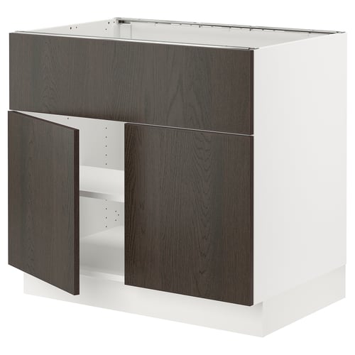 An ikea SEKTION kitchen cabinet with dark brown sinarp wood doors and a white frame.