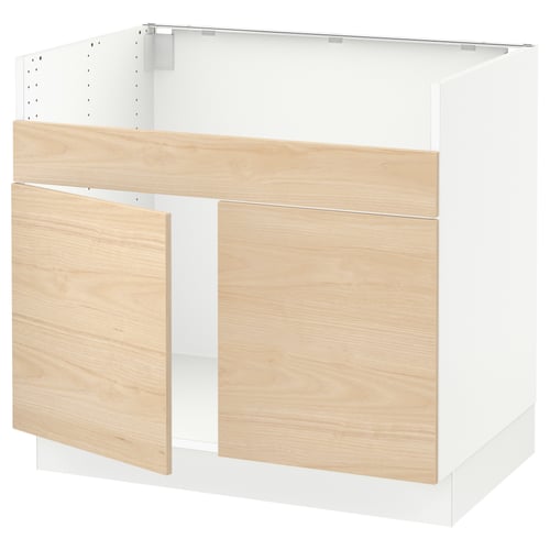 A SEKTION kitchen cabinet with light ash wood doors. It is rectangular, with a clean, modern design and a white frame.