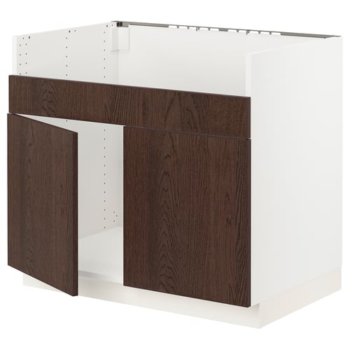 SEKTION kitchen unit. White frame, dark brown wood doors. Modern, sturdy design.