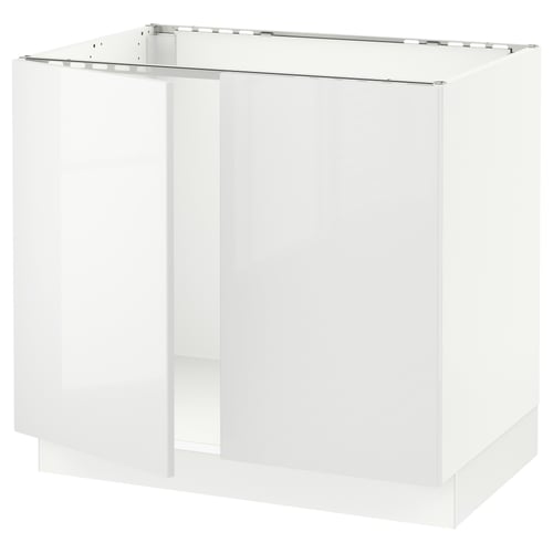 Modern high-gloss kitchen cabinet with sleek, handle-less design and glass top.