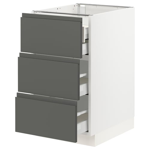 Modern kitchen cabinet in white with grey drawers. Sleek, integrated handles and high-quality material.