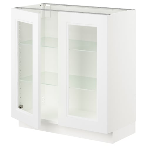 White SEKTION kitchen cabinet with glass doors and adjustable shelves.