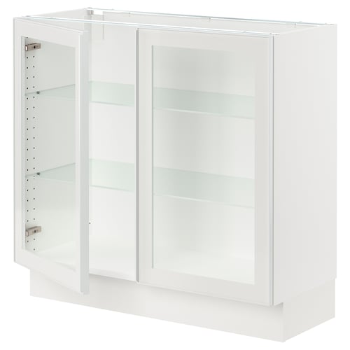 White SEKTION kitchen cabinet with glass doors and metal frames.