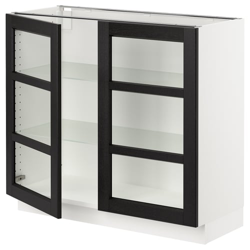 A white SEKTION kitchen cabinet with black-stained glass doors and three glass shelves. It has a modern, sleek design with bevelled edges.