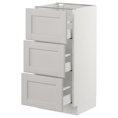 White SEKTION kitchen unit with three light grey drawers featuring bevelled edges. Modern and functional design for kitchen storage.