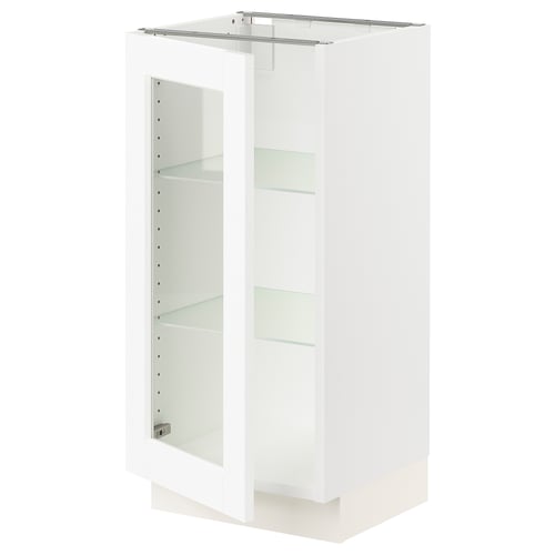 A white ikea SEKTION kitchen cabinet with glass doors and metal accessories.