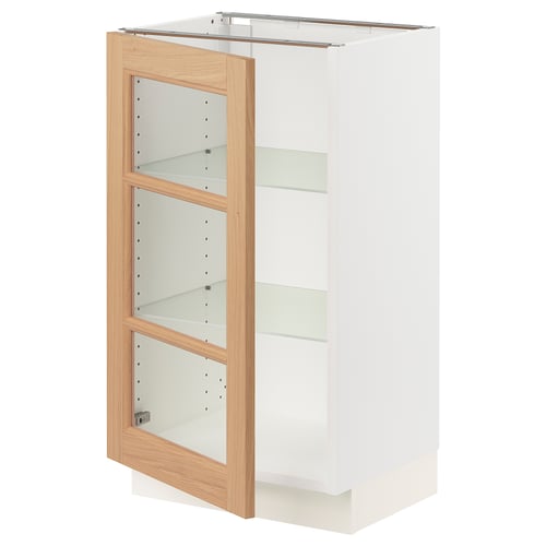 An ikea SEKTION kitchen cabinet with white and wooden doors, featuring glass shelves.