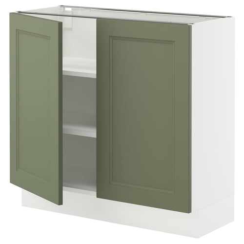 Green front, white base cabinet with two open doors showing shelves.