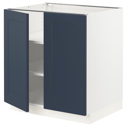 A blue ikea SEKTION kitchen cabinet with white frame and adjustable shelves.