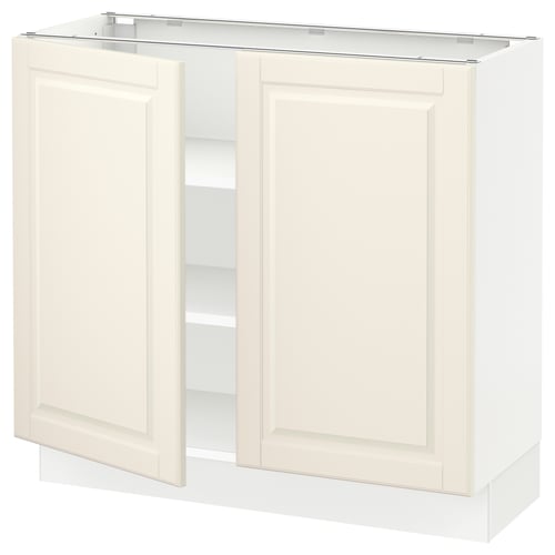 Off-white kitchen cabinet with two doors, adjustable shelves, and bevelled edges.